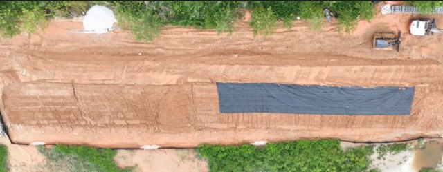 Graded haul corridor &mdash; surface and standing water after rain