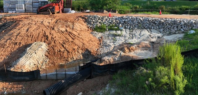 Material stockpile and equipment staging, dated